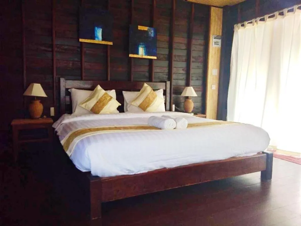 Bed in Chivaree Hotel and Resort