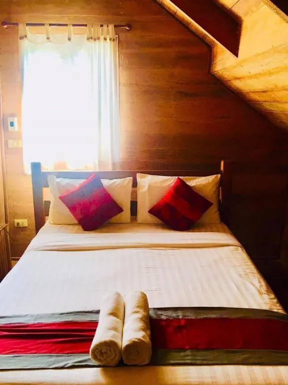 Bed in Chivaree Hotel and Resort