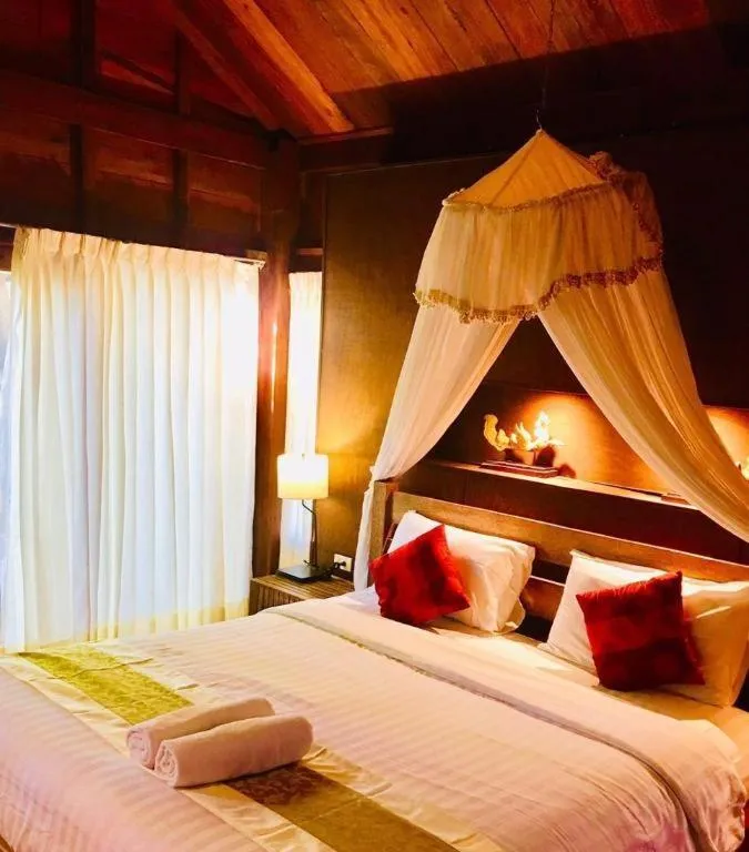 Bed in Chivaree Hotel and Resort