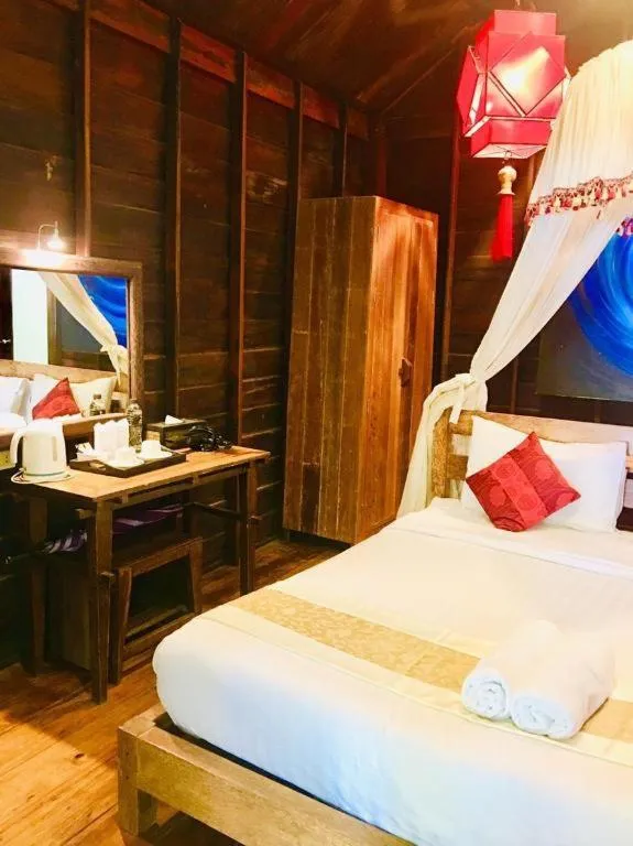 Bed in Chivaree Hotel and Resort