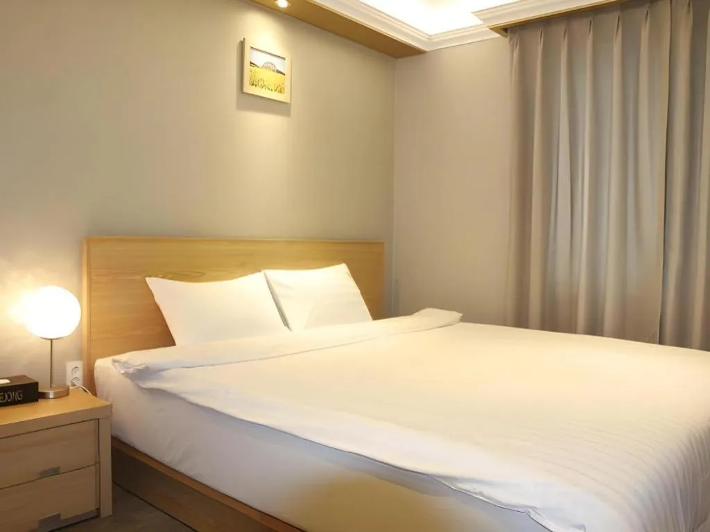 Bed in Jeju Sejong Hotel