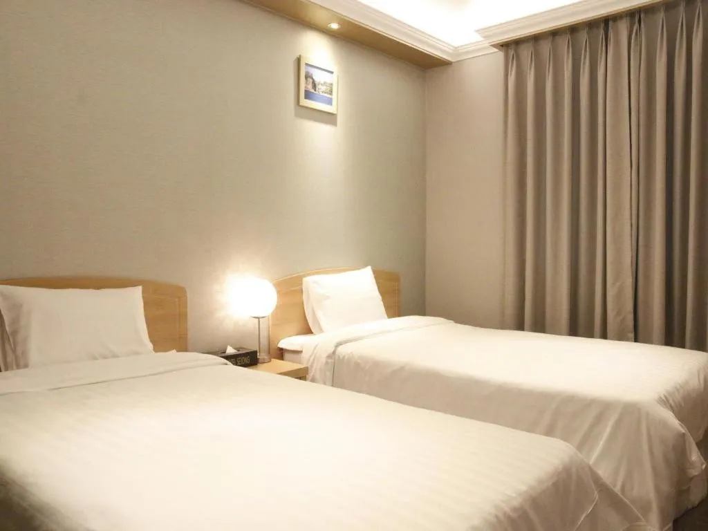 Bed in Jeju Sejong Hotel