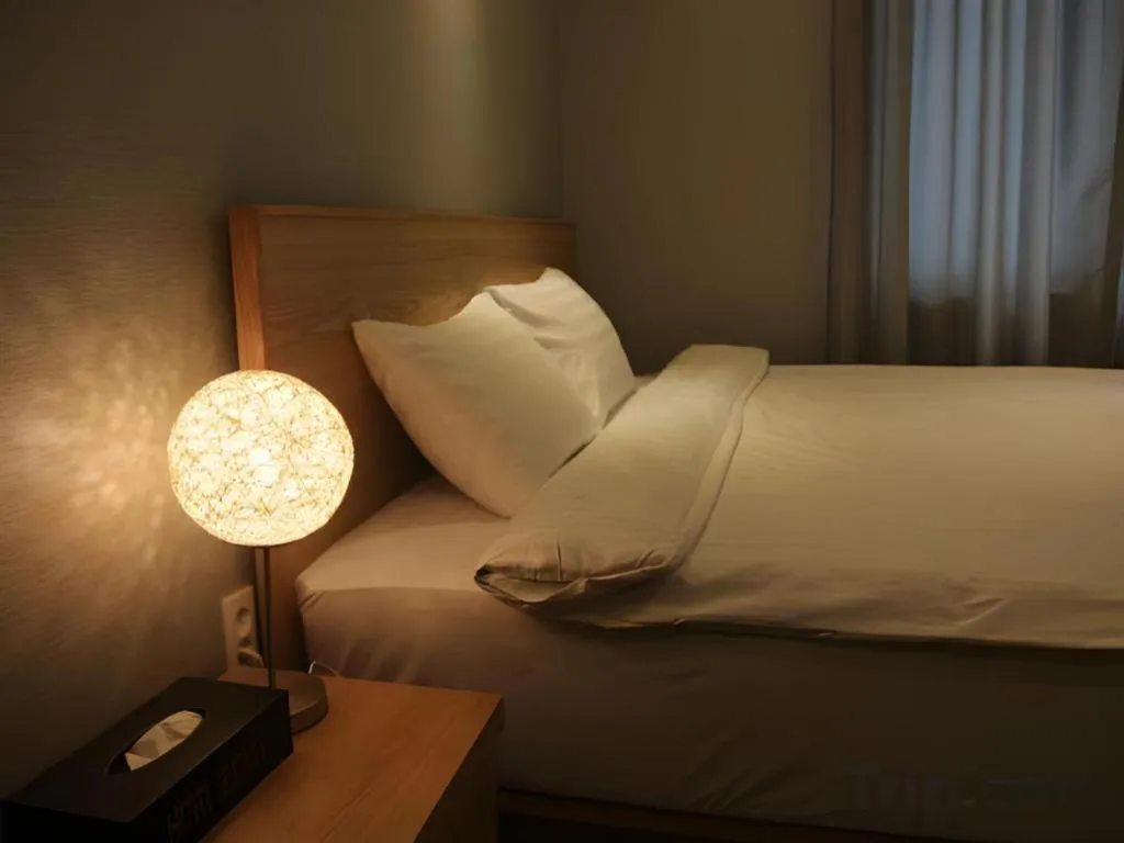 Bed in Jeju Sejong Hotel