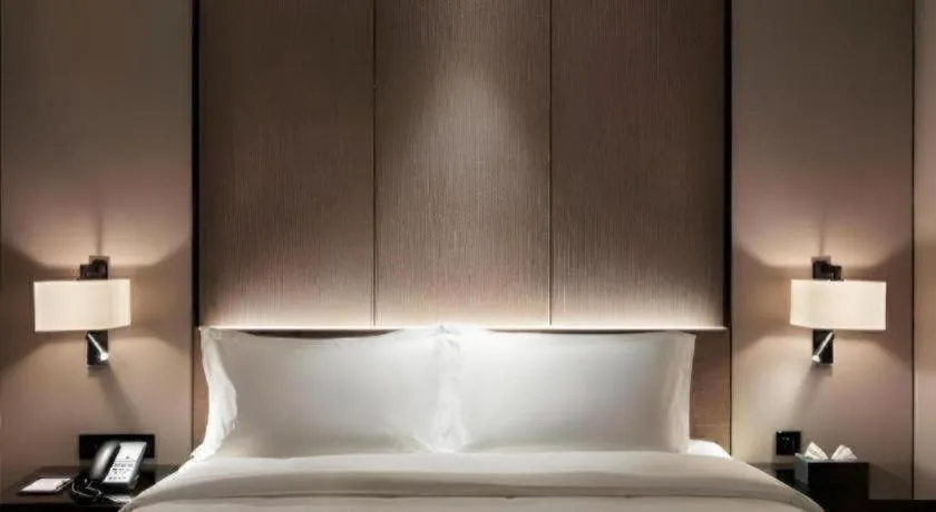 Bed in Zhonghao Boutique Hotel Dalang Business Center