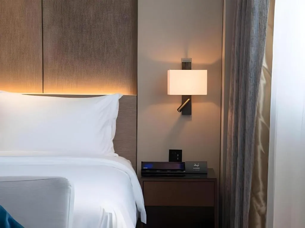 Bed in Zhonghao Boutique Hotel Dalang Business Center