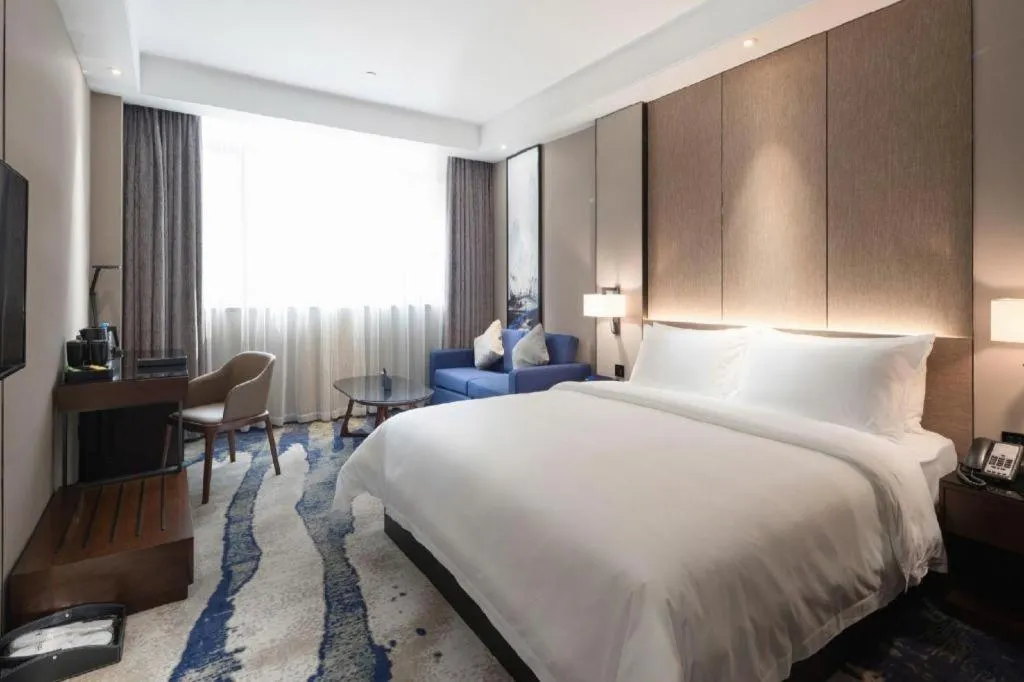 Bed in Zhonghao Boutique Hotel Dalang Business Center