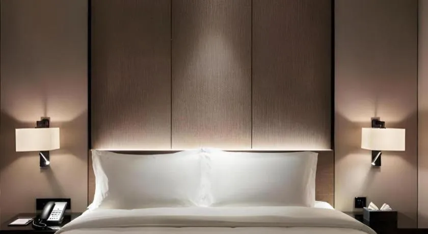 Bed in Zhonghao Boutique Hotel Dalang Business Center