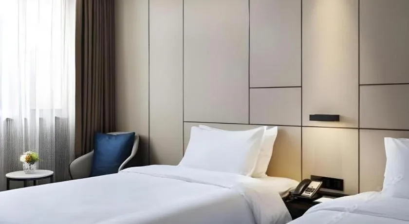 Bed in Zhonghao Boutique Hotel Dalang Business Center