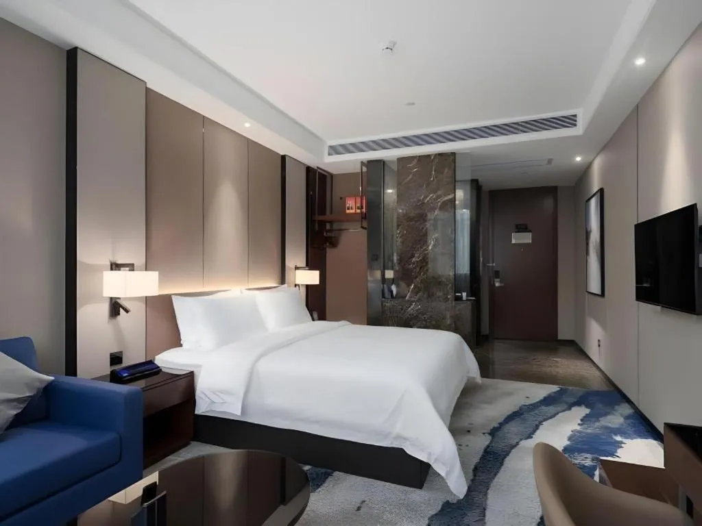 Bed in Zhonghao Boutique Hotel Dalang Business Center