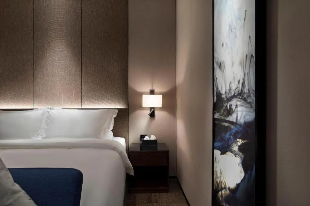 Bed in Zhonghao Boutique Hotel Dalang Business Center
