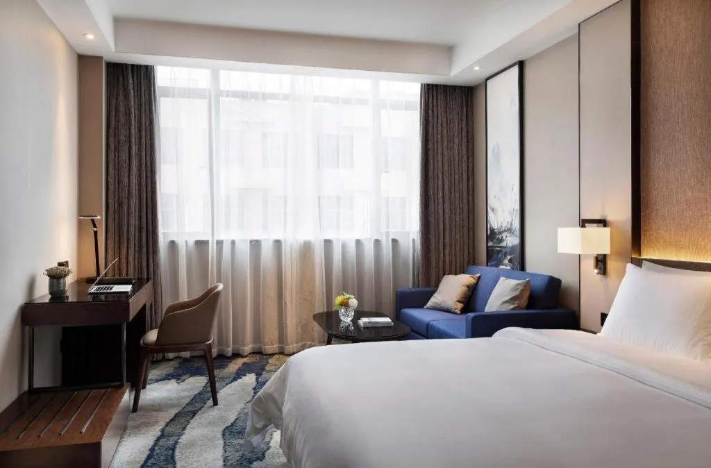 Bed in Zhonghao Boutique Hotel Dalang Business Center