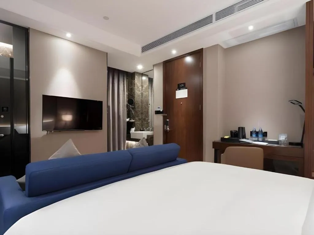 Bed in Zhonghao Boutique Hotel Dalang Business Center