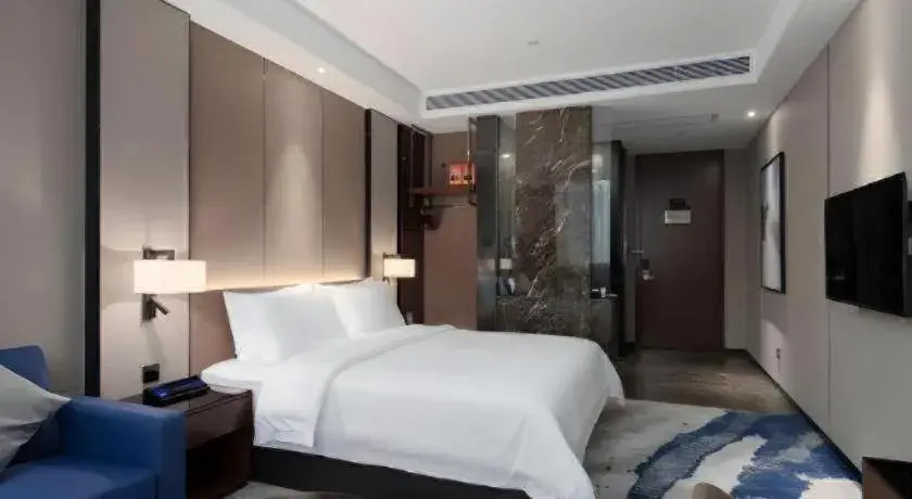 Bed in Zhonghao Boutique Hotel Dalang Business Center Bed in Zhonghao Boutique Hotel Dalang Business Center