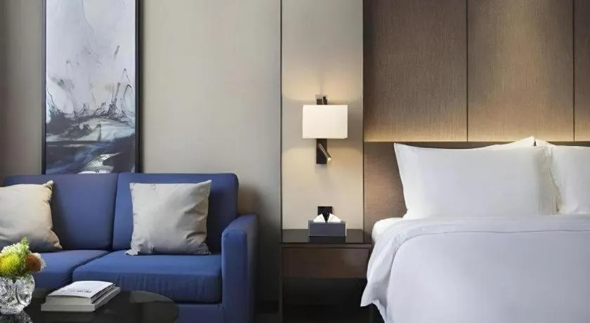 Bed in Zhonghao Boutique Hotel Dalang Business Center