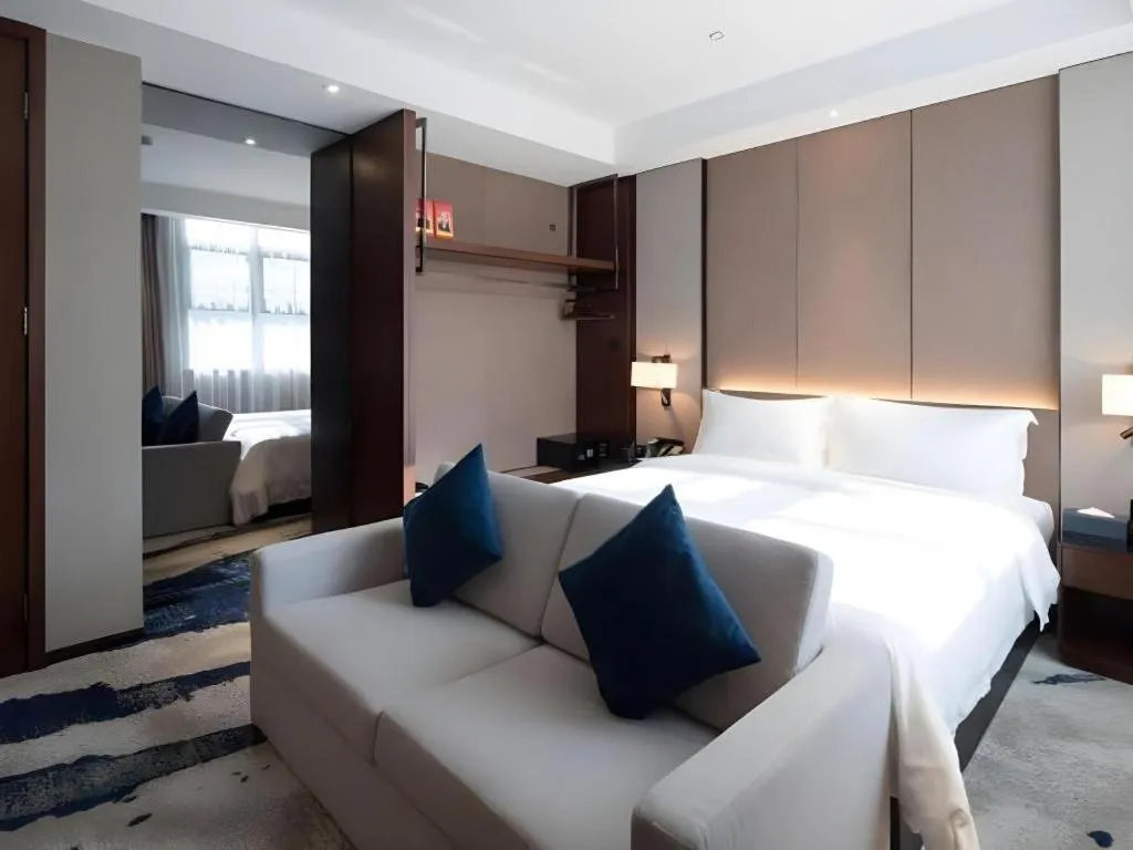 Bed in Zhonghao Boutique Hotel Dalang Business Center
