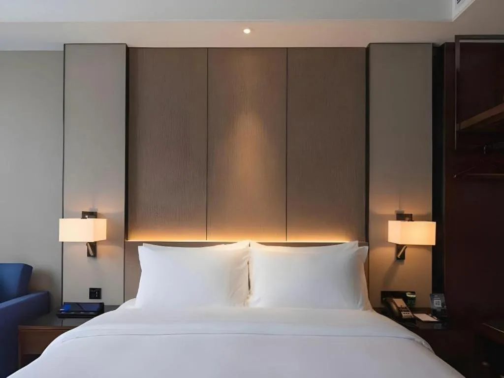 Bed in Zhonghao Boutique Hotel Dalang Business Center