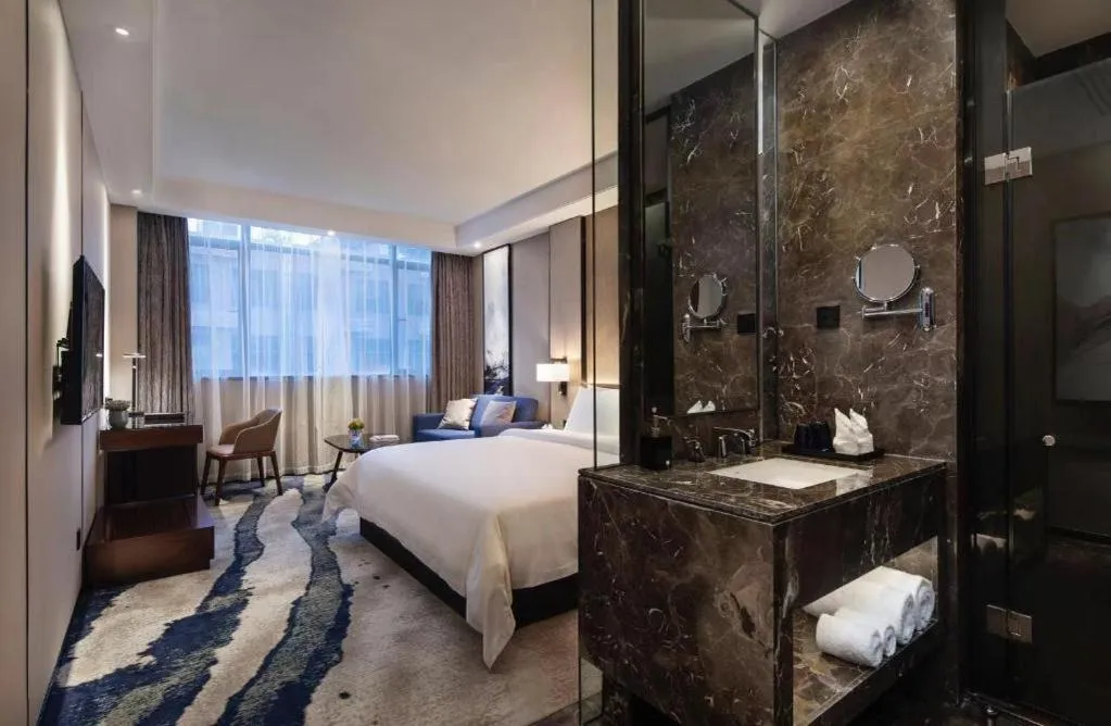 Bed in Zhonghao Boutique Hotel Dalang Business Center