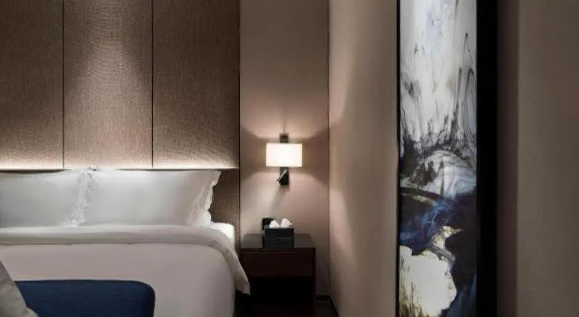 Bed in Zhonghao Boutique Hotel Dalang Business Center