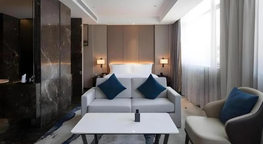 Bed in Zhonghao Boutique Hotel Dalang Business Center