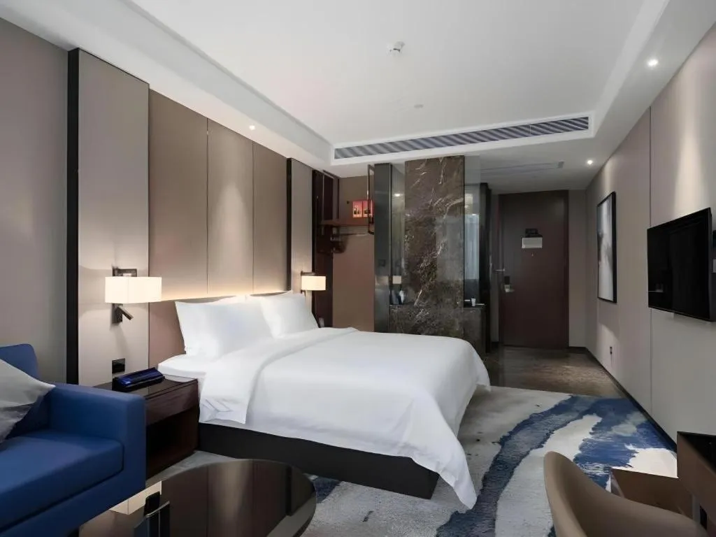 Bed in Zhonghao Boutique Hotel Dalang Business Center