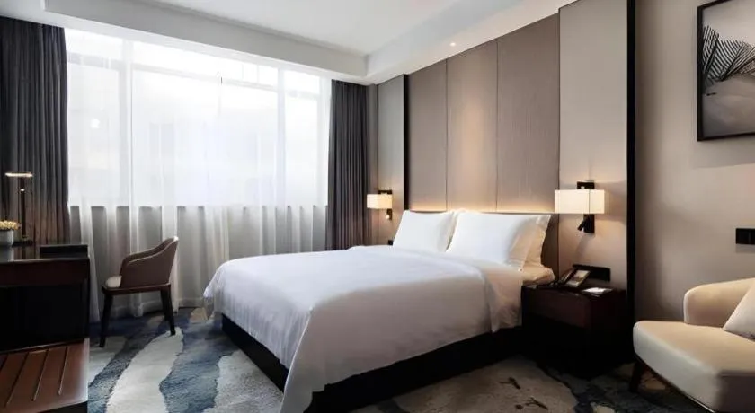 Bed in Zhonghao Boutique Hotel Dalang Business Center