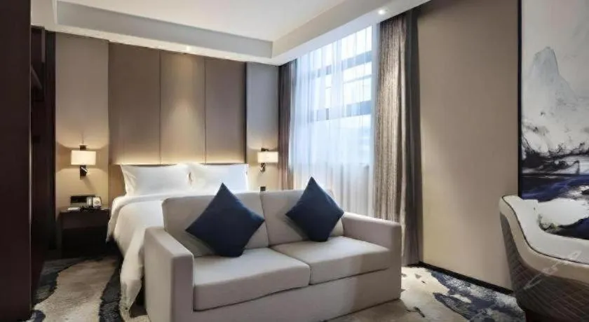 Bed in Zhonghao Boutique Hotel Dalang Business Center