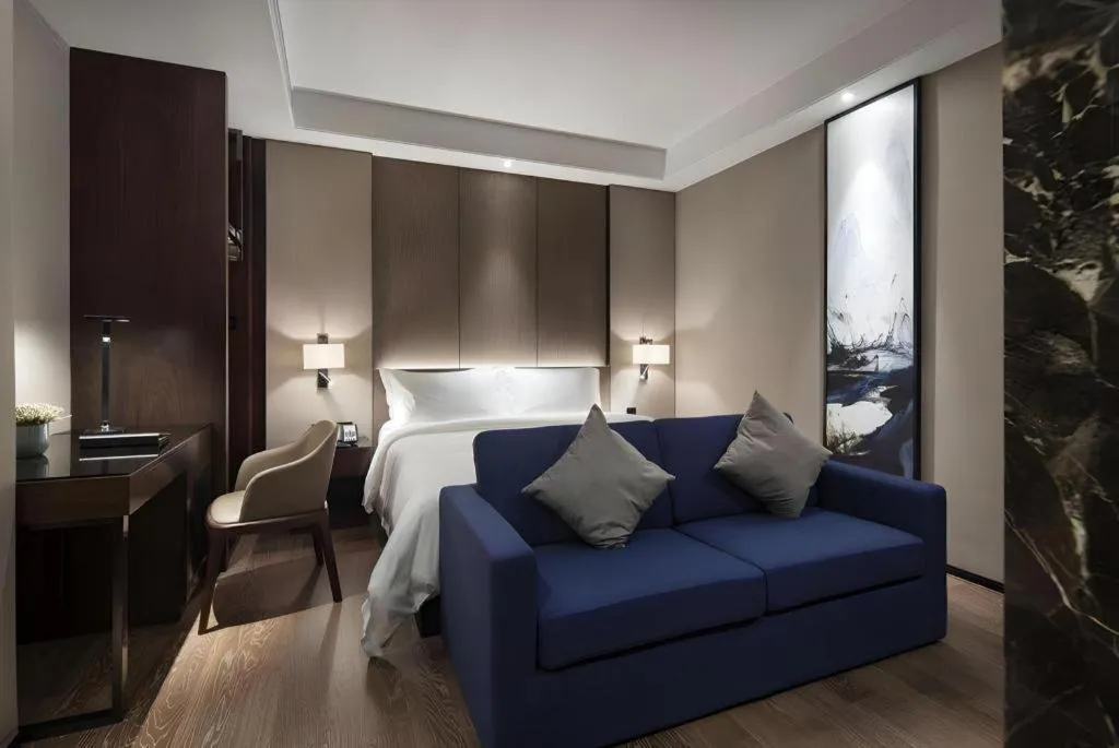Bed in Zhonghao Boutique Hotel Dalang Business Center