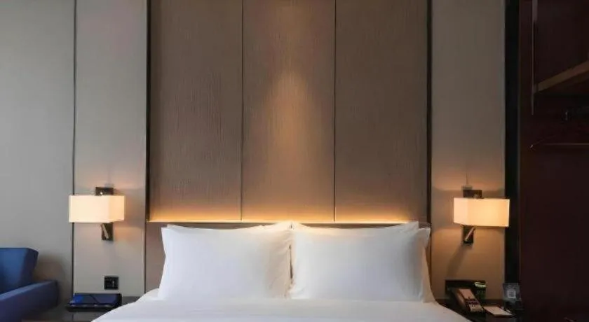 Bed in Zhonghao Boutique Hotel Dalang Business Center