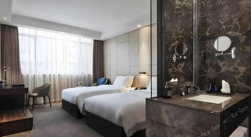 Bed in Zhonghao Boutique Hotel Dalang Business Center