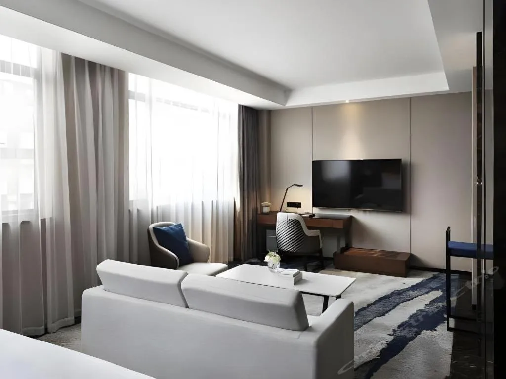 Bed in Zhonghao Boutique Hotel Dalang Business Center