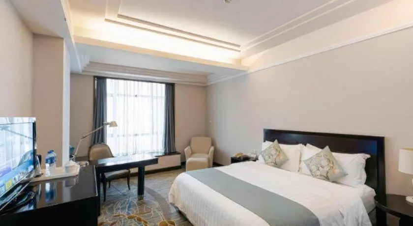 Bed in New Century Pujiang Hotel