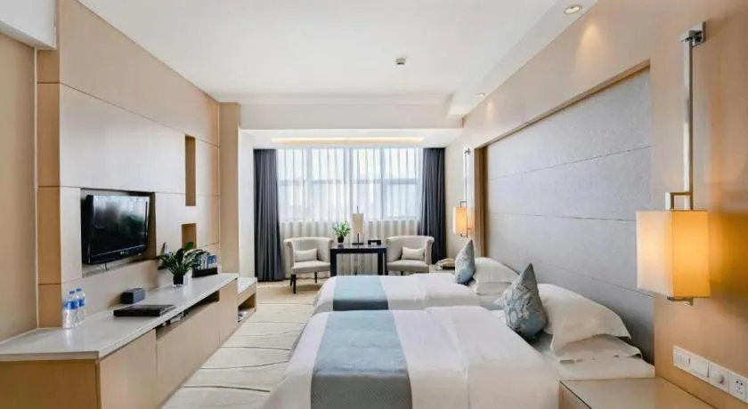 Bed in New Century Pujiang Hotel
