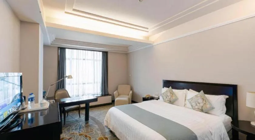 Bed in New Century Pujiang Hotel
