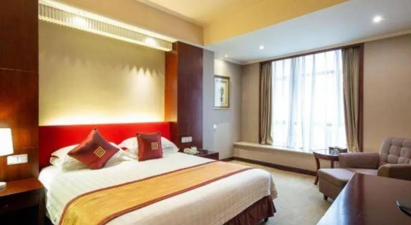 Bed in New Century Pujiang Hotel
