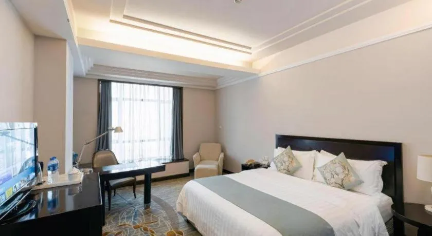 Bed in New Century Pujiang Hotel