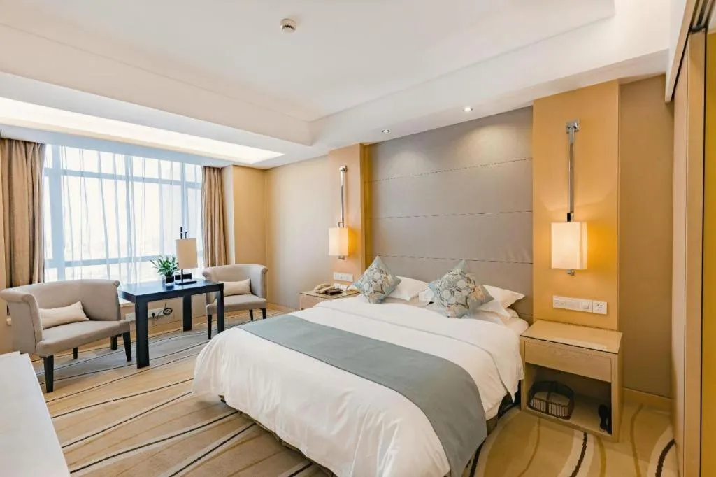 Bed in New Century Pujiang Hotel