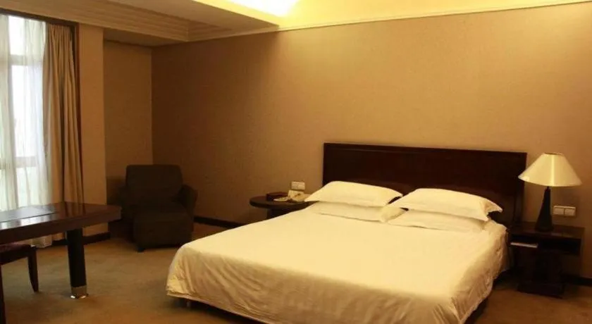 Bed in New Century Pujiang Hotel