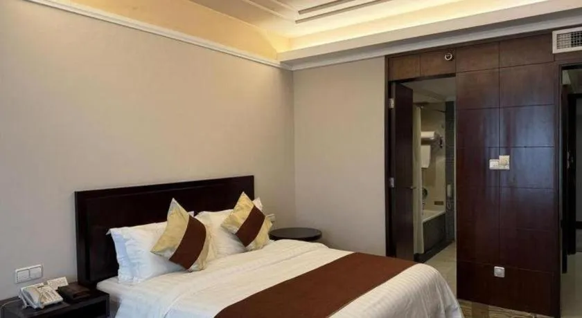 Bed in New Century Pujiang Hotel