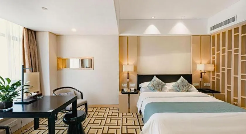 Bed in New Century Pujiang Hotel