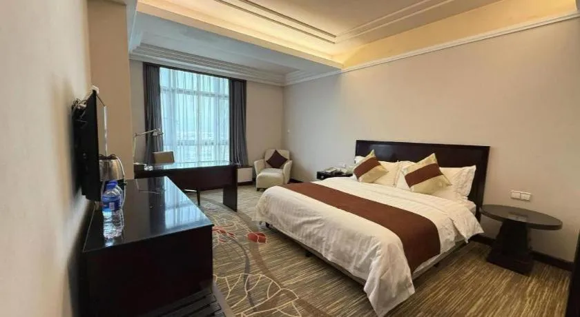 Bed in New Century Pujiang Hotel
