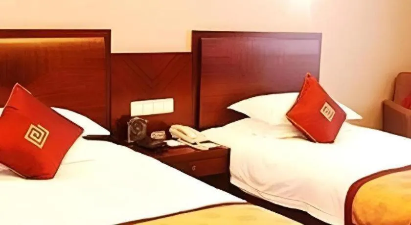 Bed in New Century Pujiang Hotel
