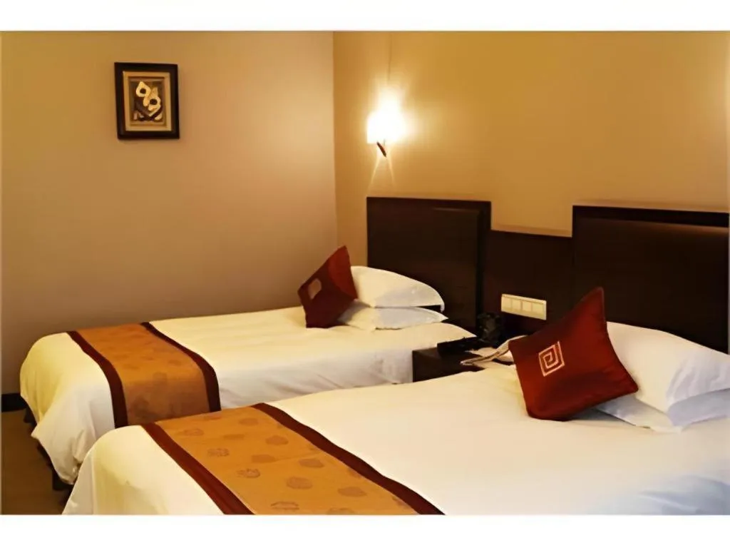 Bed in New Century Pujiang Hotel