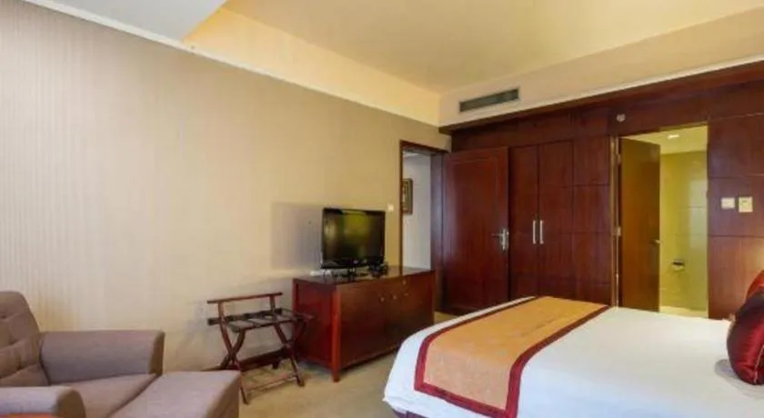 Bed in New Century Pujiang Hotel