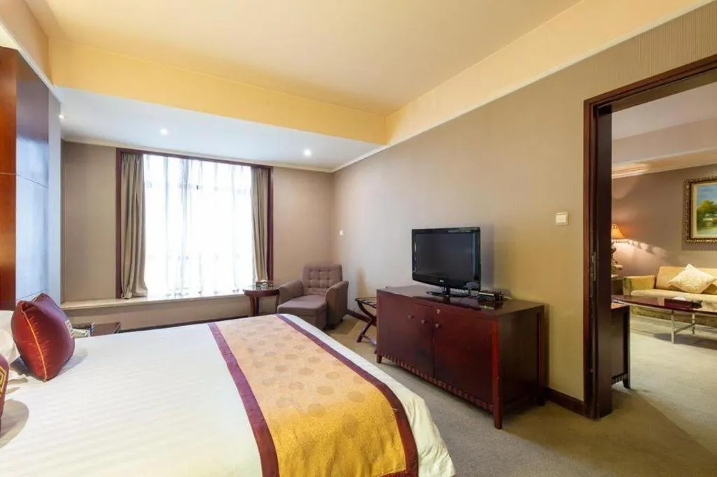 Bed in New Century Pujiang Hotel