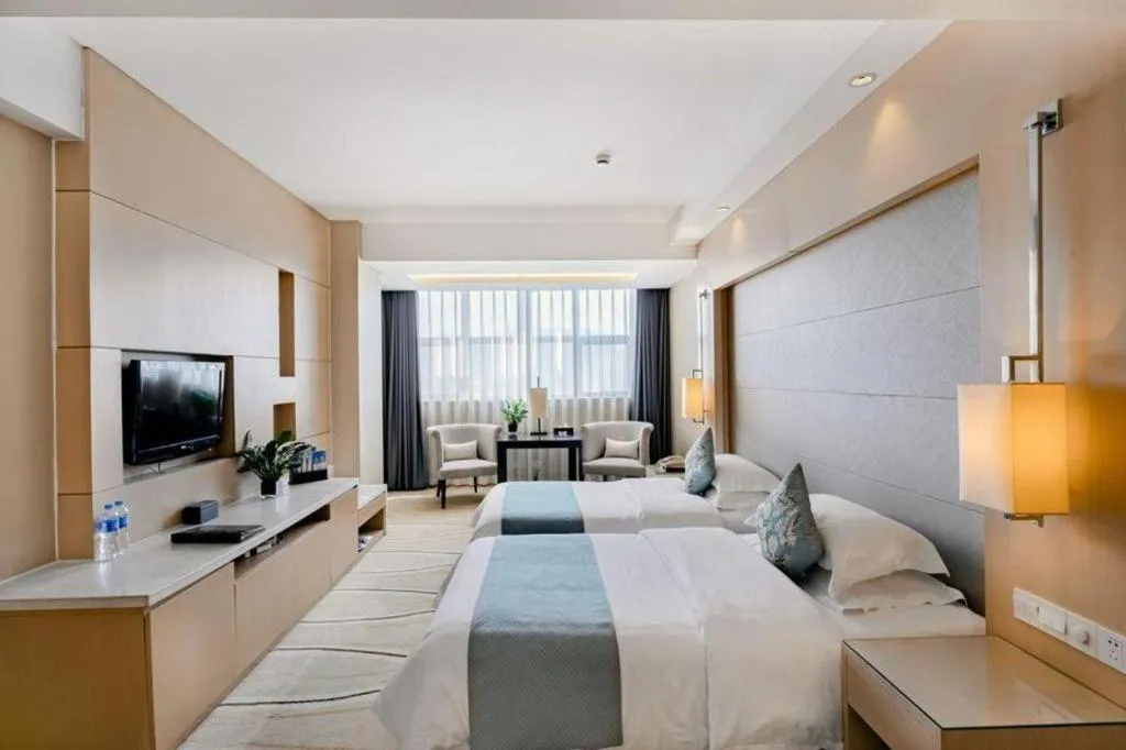 Bed in New Century Pujiang Hotel