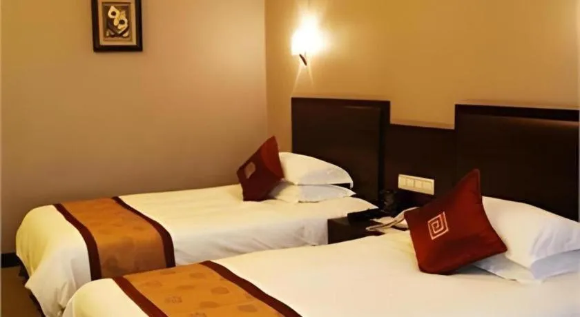 Bed in New Century Pujiang Hotel