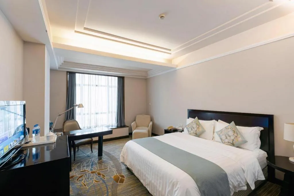Bed in New Century Pujiang Hotel
