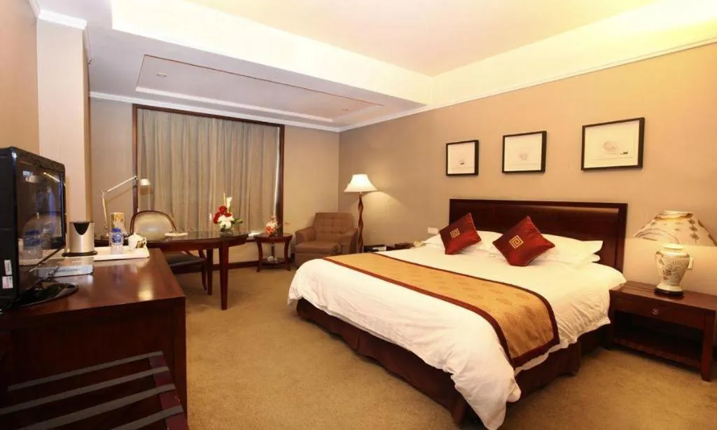 Bed in New Century Pujiang Hotel