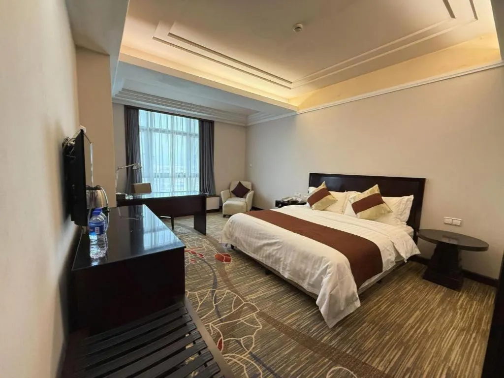 Bed in New Century Pujiang Hotel