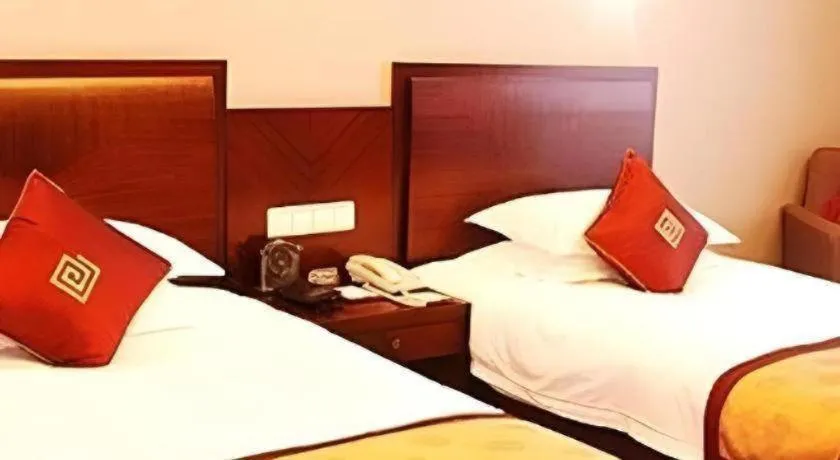 Bed in New Century Pujiang Hotel